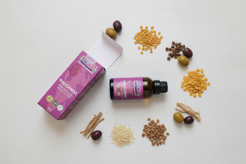 Elegant flat lay with NALGAMAX packaging and ingredients